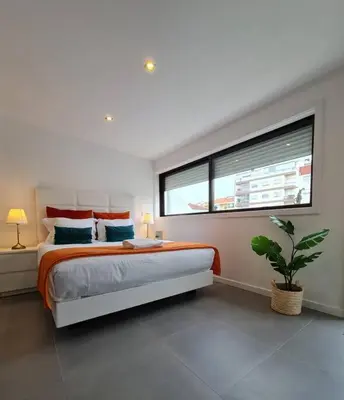 a bedroom with a large bed and a window at INSOLI I Porto by Apartments2Stay in Porto