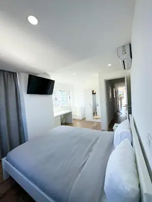 a white bathroom with a toilet and a shower at Fantástico T3 Porto - 6 Pessoas in Porto