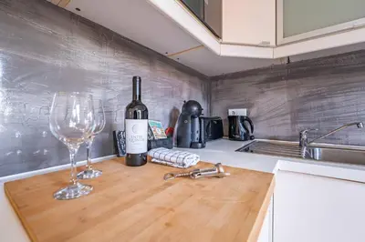 a bedroom with a bed with two towels on it at Brittos Lapa Apartment in Oporto City Center in Porto