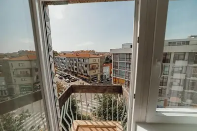 an open window with a view of a parking lot at GuestReady - A sunny moment in Porto in Porto