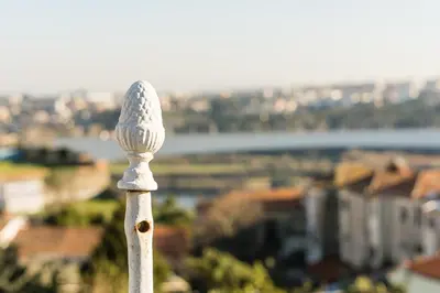a white pole with a view of a city at PortoNest Downtown Studios in Porto