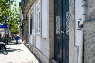 a blue door on the side of a building at Apartment Oportoloft in Porto