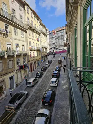 a city street with cars parked on the street at São João Boutique Apartment in Porto