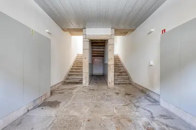an empty hallway with stairs in a building at OPORTO GUEST Luxus Ildefonso in Porto