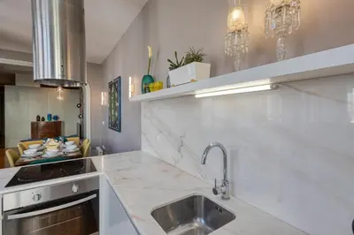 a kitchen with a sink and a counter top at OPORTO GUEST Luxus Ildefonso in Porto