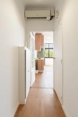 a white desk with a chair in a room at Host Wise - Comfy Minimalist Flat in Porto