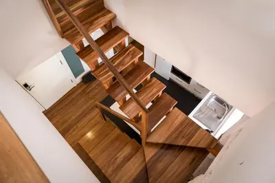 an overhead view of a wooden staircase in a house at Clérigos Design by Hosty in Porto