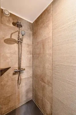a bathroom with a shower with a shower head at VIVA Peaceful Zen Retreat in Porto