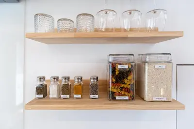 a shelf with glass jars and other items on it at Urban Loft in Porto