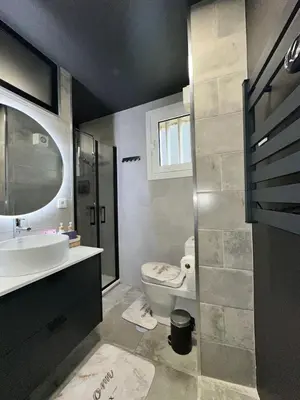 a bathroom with a white toilet and a sink at Porto Charme Residence in Porto