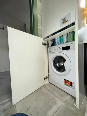 a white washer and dryer in a laundry room at Porto Charme Residence in Porto