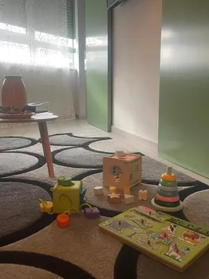 a room with a table and toys on the floor at Porto Charme Residence in Porto
