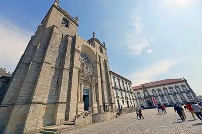 a group of people walking in front of a building at FLH Boavista Woody Flats in Porto