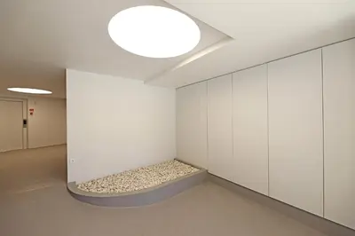 a room with a bed in a wall at FLH Boavista Woody Duplexes in Porto