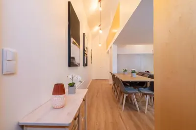 a living room with a table and a dining room at Host Wise - Central Duplex House - Terrace in Vila Nova de Gaia