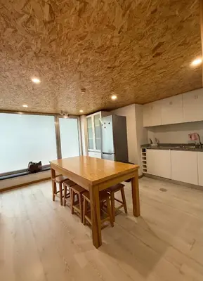 a kitchen with a wooden table in a room at Porto Encanto- 7 Bedrooms in Porto