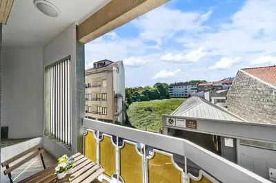 a balcony with a view of a building at Apartamento D' Alegria in Porto
