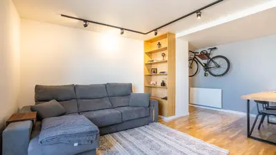 a living room with a couch and a table at Capelo Residency by LovelyStay in Porto