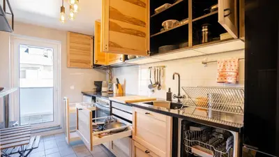 a kitchen with a sink and a dishwasher at Capelo Residency by LovelyStay in Porto