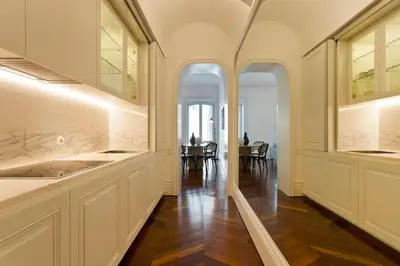 a kitchen with a sink and a dining room at Boutique Rentals- THE CLéRiGoS Apt w/ patio in Porto
