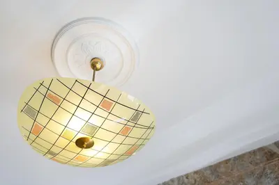 a light fixture hanging from a ceiling at GuestReady - Porto's Charming Escape in Porto