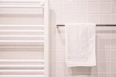 a towel hanging on a towel rack in a bathroom at GuestReady - Porto's Charming Escape in Porto