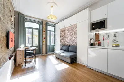 a living room with a couch and a table at GuestReady - Porto's Charming Escape in Porto
