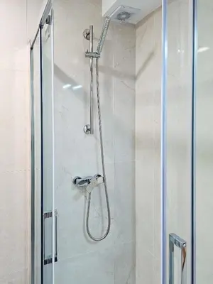 a bathroom with a shower with a glass door at VIVA Boho House Duplex in Porto