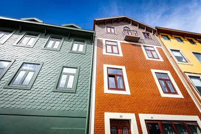 a group of buildings next to each other at Fervença Suites in Vila Nova de Gaia