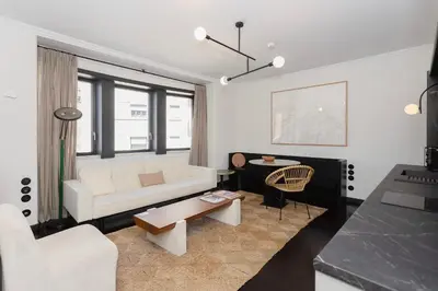 a living room with a white couch and a table at Liiiving in Porto - Casa Duque Apartments in Porto