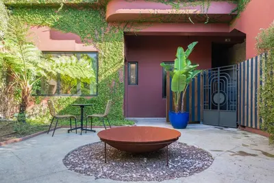 a patio with a table and chairs in front of a building at Liiiving in Porto - Casa Duque Apartments in Porto