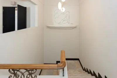 a room with a bench and a mirror on the wall at Liiiving in Porto - Casa Duque Apartments in Porto