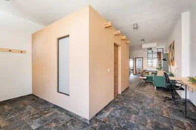 an office with a large window on the wall at GuestReady - Modern Home In Gaia in Vila Nova de Gaia