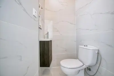 a kitchen with a white refrigerator and a microwave at Camarão Apartment in Porto