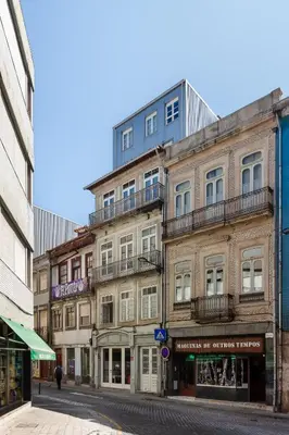 a tall building on a city street at Stylish Loft in the city centre in Porto