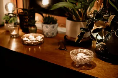 a wooden table with two candles and plants on it at Central apartment w/ garden terrace in Porto