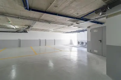 an empty room with a concrete floor in a building at T2 Constituição in Porto