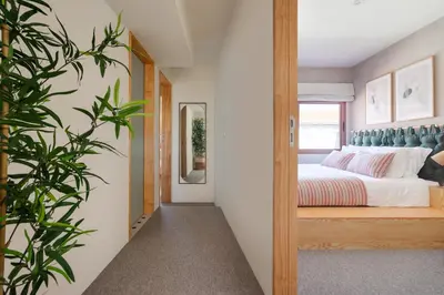 a bedroom with a bed and a mirror at Trendy & Charming Apartment • Porto city center in Porto