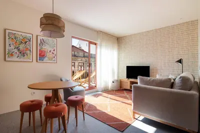 a living room with a couch and a table at Trendy & Charming Apartment • Porto city center in Porto