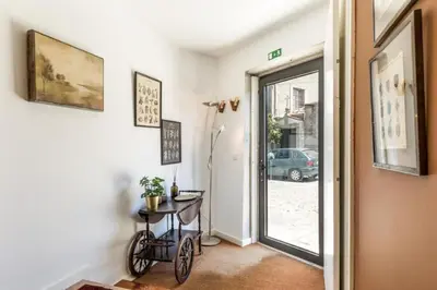 a room with a bike sitting next to a door at Cute 1-bedroom next to Douro River in Porto