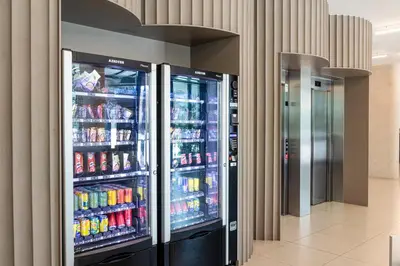 two refrigerators in a store with drinks in them at B&B HOTEL Porto Gaia in Vila Nova de Gaia
