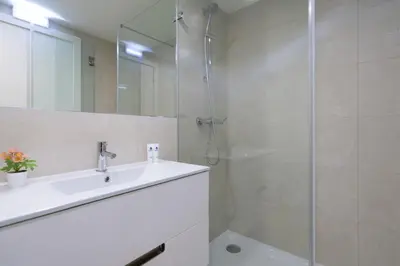 a bathroom with a sink and a shower at Host Wise - Central Private Flats - Terrace in Porto