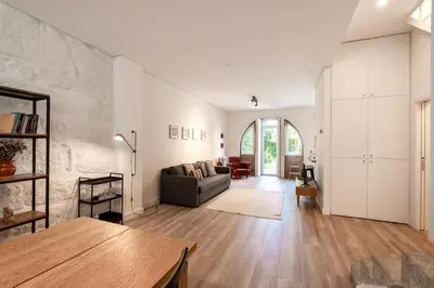 a living room with a couch and a table at VIVA Boavista Vintage House in Porto