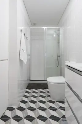 a white bathroom with a toilet and a shower at Host Wise - Modern Urban Flat in Porto