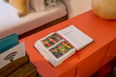 a book sitting on top of a table at Green Hideaway by LovelyStay in Porto