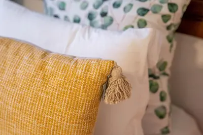 a close up of a pillow on a bed at Green Hideaway by LovelyStay in Porto