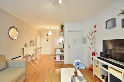 a living room with a couch and a television at Lips Friendship Shelter in Porto