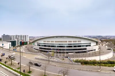 a large building with a road in front of it at Unique Antas Park in Porto