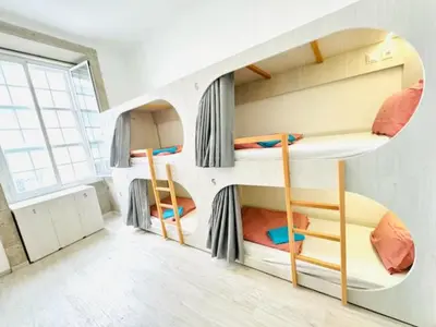 a room with three bunk beds in it at Fantasy Hostel Porto in Porto