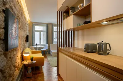 a kitchen with a counter with a microwave on it at Live In Porto - Codeçal in Porto